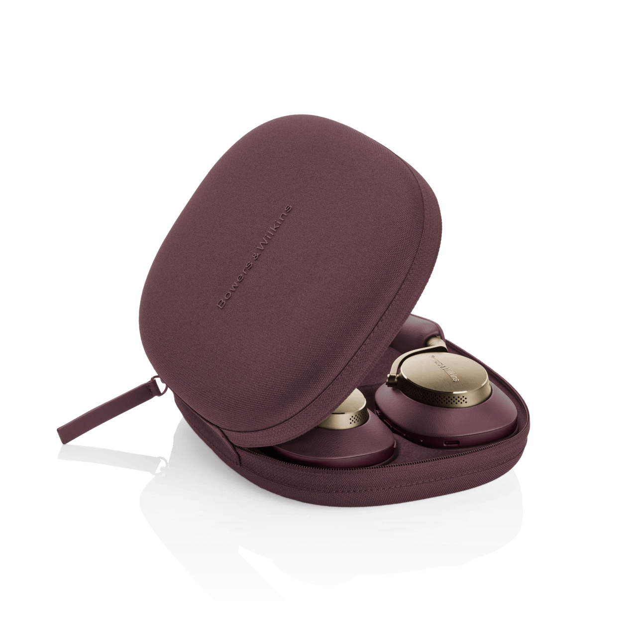 Maroon travel case with gold components on a white background