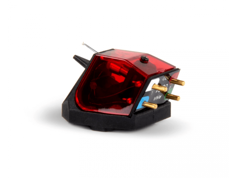 Record player cartridge with red transparent cover on a white background