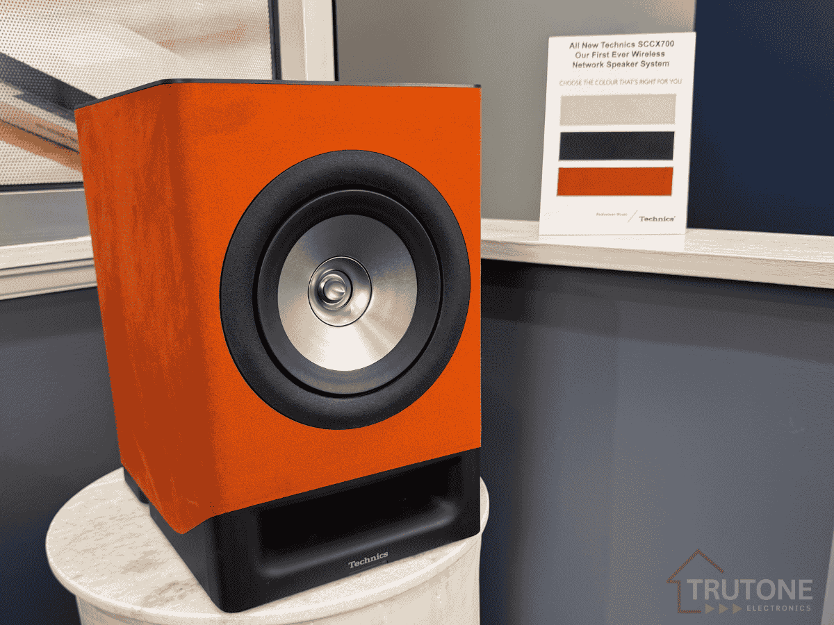 Technics SC-CX700 Orange Speaker - Side View Lifestyle Image