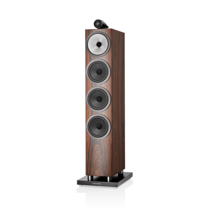 Wooden floor-standing speaker with multiple speakers on a white background