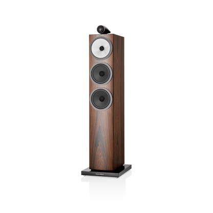 Wooden floor-standing speaker with a white background