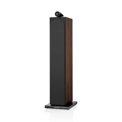 Tall black and wood speaker on a white background