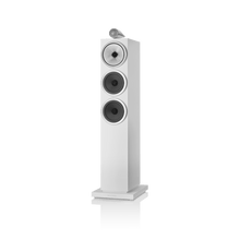 White floor-standing speaker on a black background