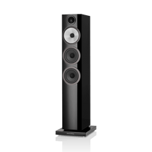 Black floor-standing speaker on a white background