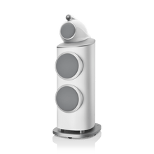 White speaker with gray circular components on a white background