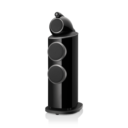 Black cylindrical speaker with three circular grills on a white background