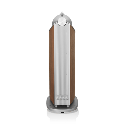 Tall cylindrical speaker with wooden finish and silver top on a white background