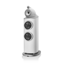 White speaker with two circular grilles on a white background