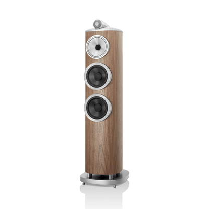 Wooden speaker with metallic accents on a white background