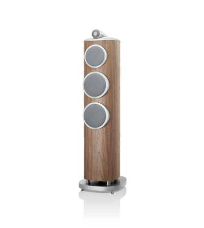 Wooden speaker with three circular gray drivers on a white background