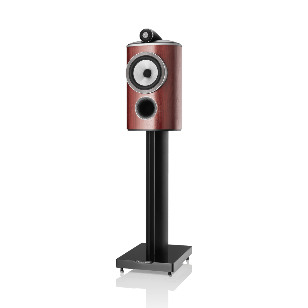 Speaker with wooden finish and black stand on a white background