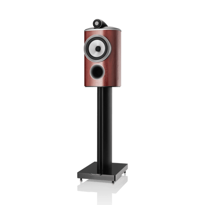Speaker with wooden finish and black stand on a white background