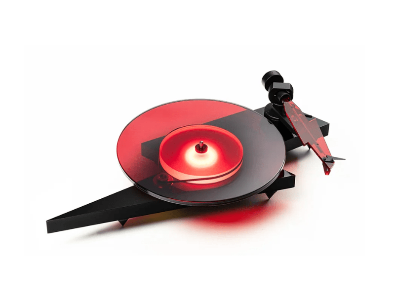Turntable with red platter and black tonearm on a white background