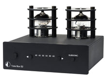 Black audio equipment with tube components on a white background