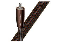 Coiled audio cable with braided design and 'COFFEE' label on a white background