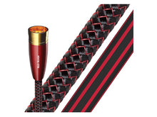 Black and red braided product with a red and gold cylindrical object labeled 'Red River' on a white background.