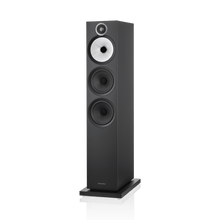 Black floor-standing speaker on a white background