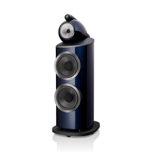 Blue and black speaker on a white background