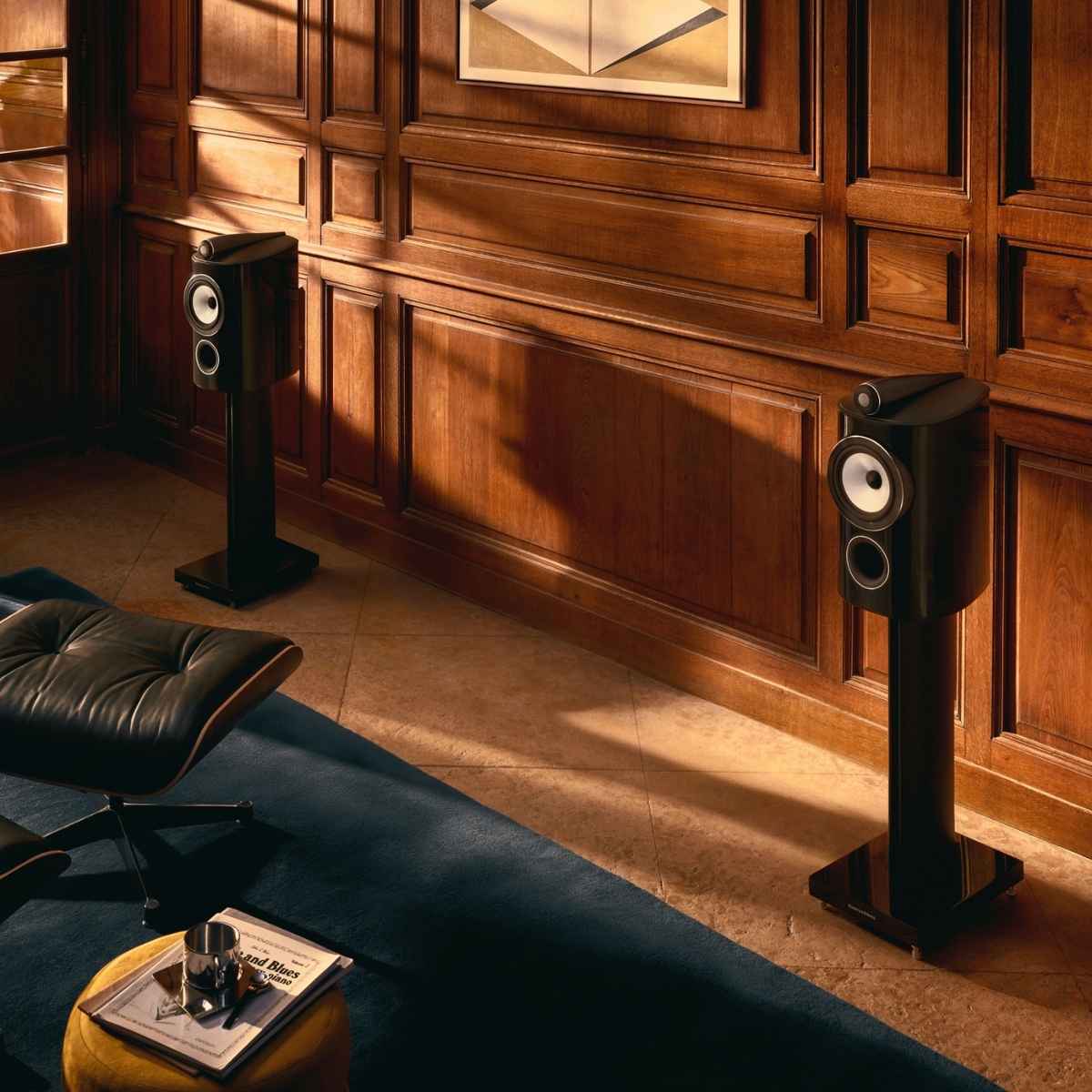 black pair of bowers wilkins 805 d5 speakers in a room