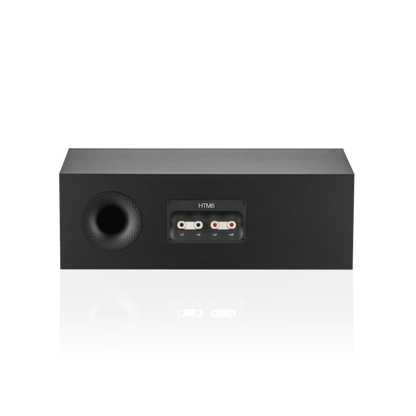 Black audio speaker with connectivity ports on a white background