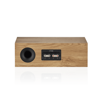 Wooden speaker with control panel on a white background
