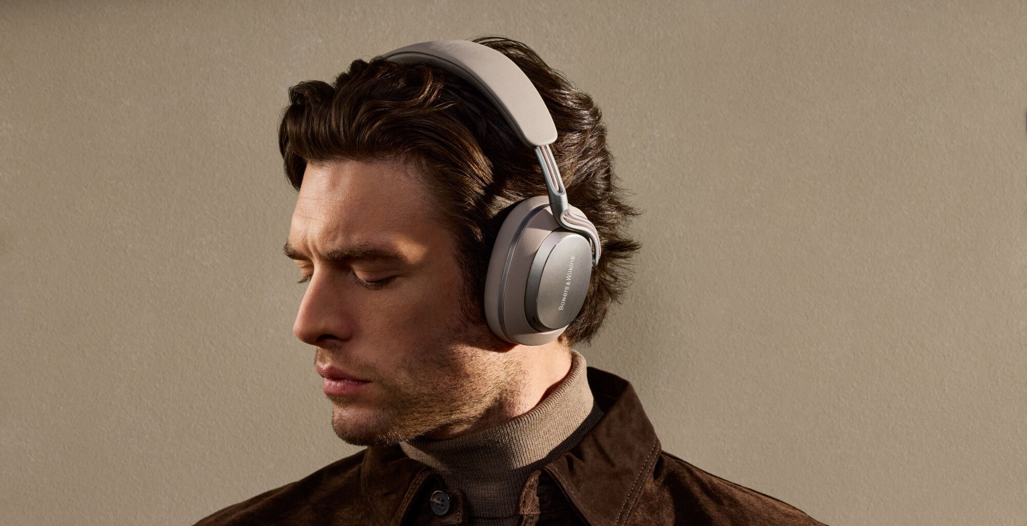a model man wearing bowers wilkins px8 s2 headphones