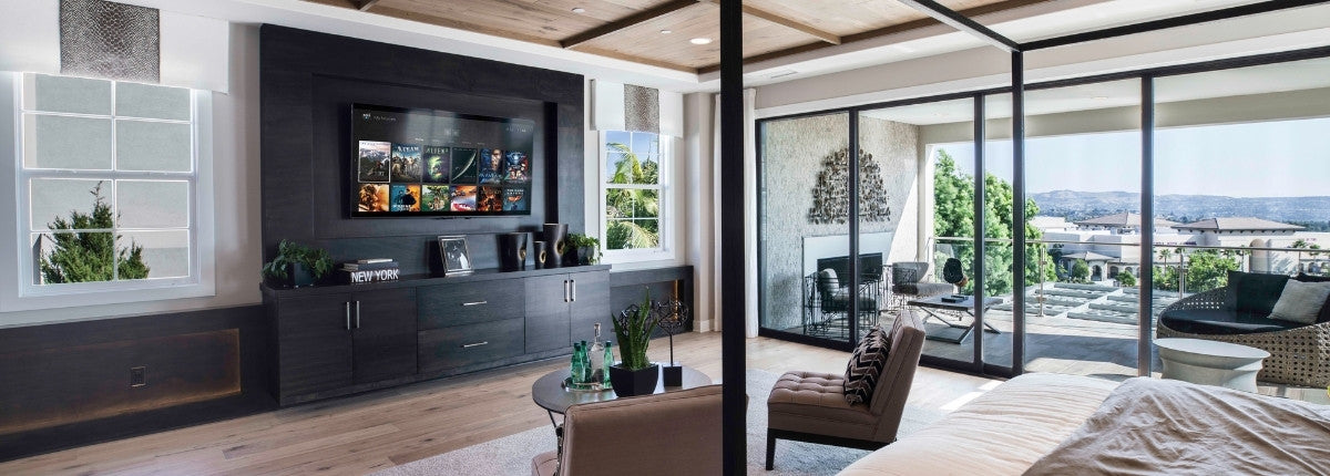 a bright living room with tv on wall