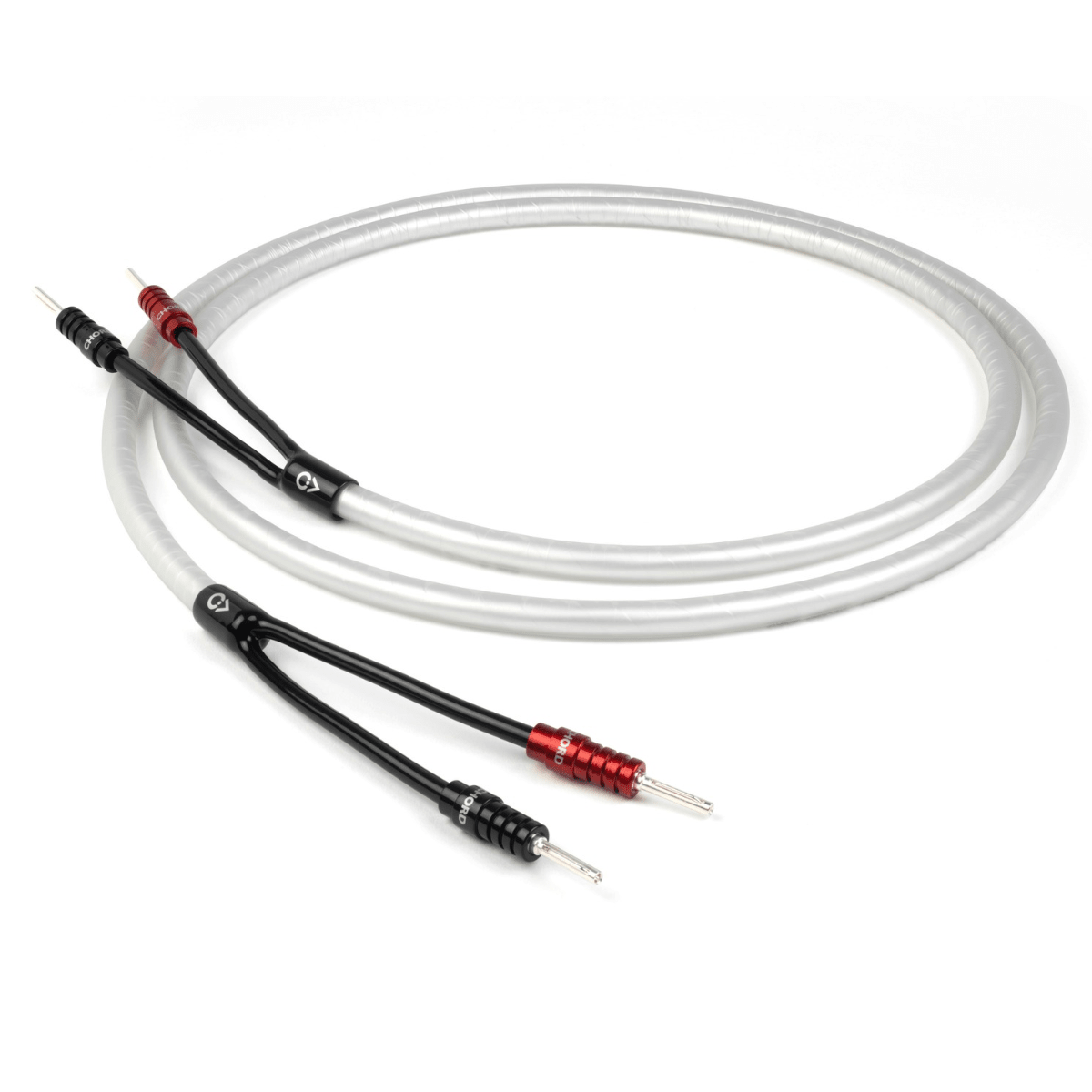 Chord Company ClearwayX speaker cable terminated pair with red and black ChordOhmic banana plugs, coiled on white background