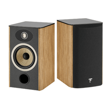 a pair of focal aria evo x n1 bookshelf speakers in walnut