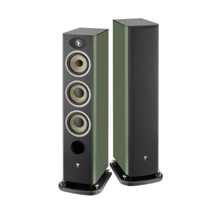 a pair of focal aria evo x n2 floorstanding speakers in green