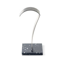 Focal High-Fidelity Headphone Stand with brushed stainless steel arch and recycled polymer base in black finish.
