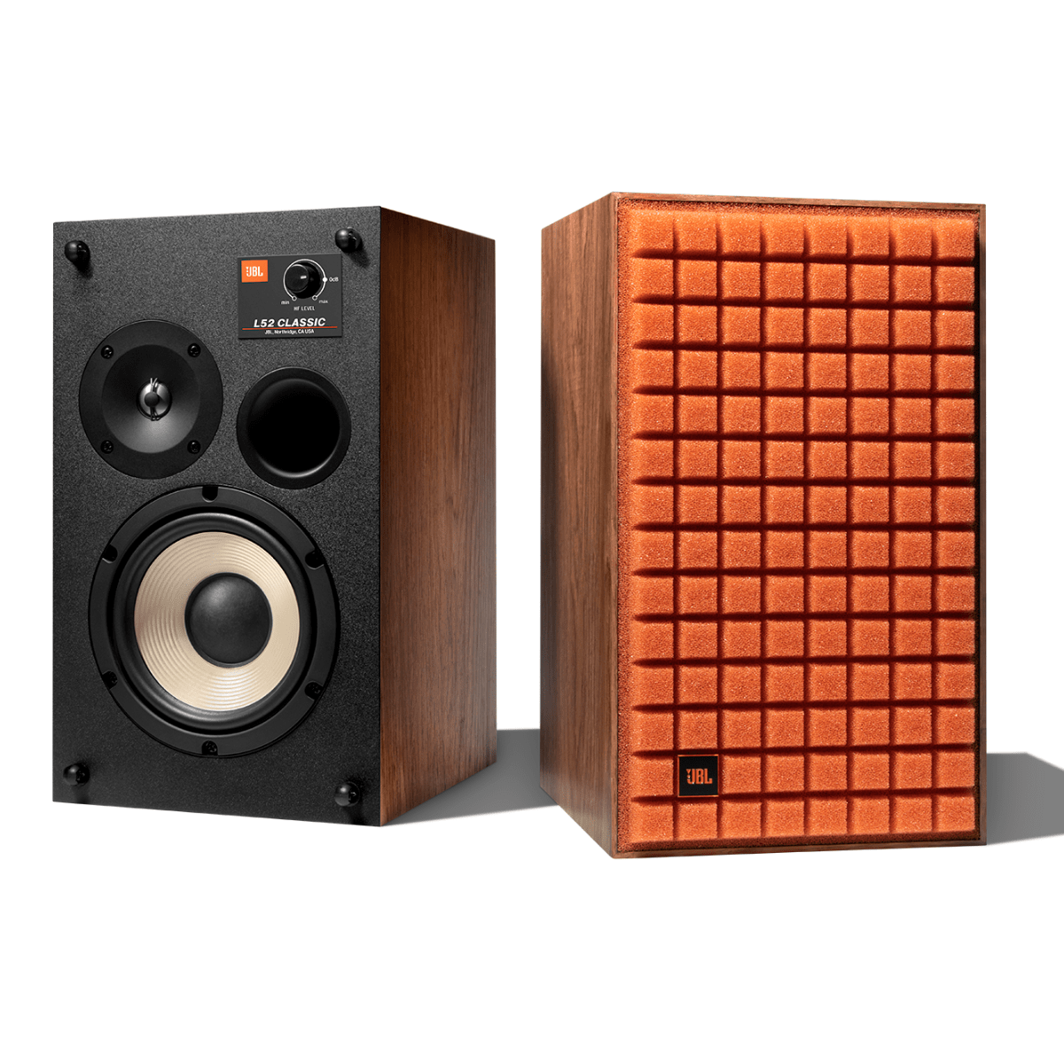 JBL L52 Classic bookshelf speaker pair in walnut finish, one with exposed white cone woofer and tweeter, the other with orange Quadrex foam grille.