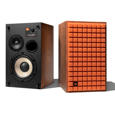 JBL L52 Classic bookshelf speaker pair in walnut finish, one with exposed white cone woofer and tweeter, the other with orange Quadrex foam grille.