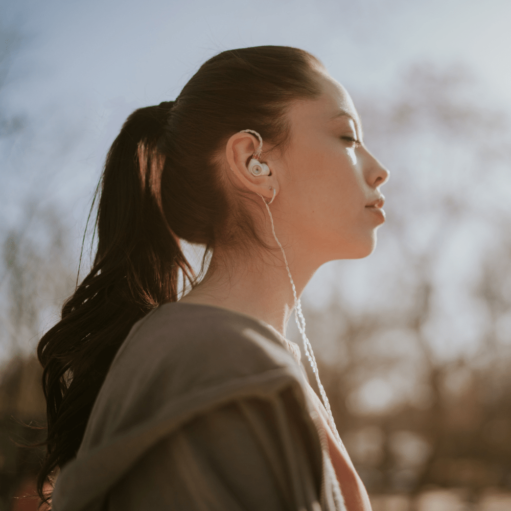 woman listening meze audio alba earbuds