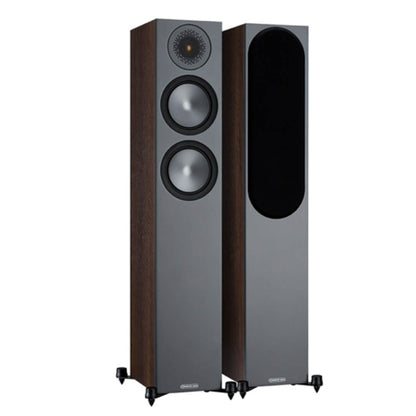 Pair of floor-standing speakers on a white background