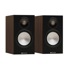 pair of monitor audio bronze 50 7g bookshelf speakers in walnut color