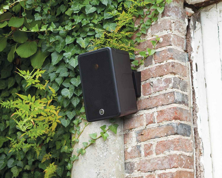 outdoor speaker installed on brick wall outside