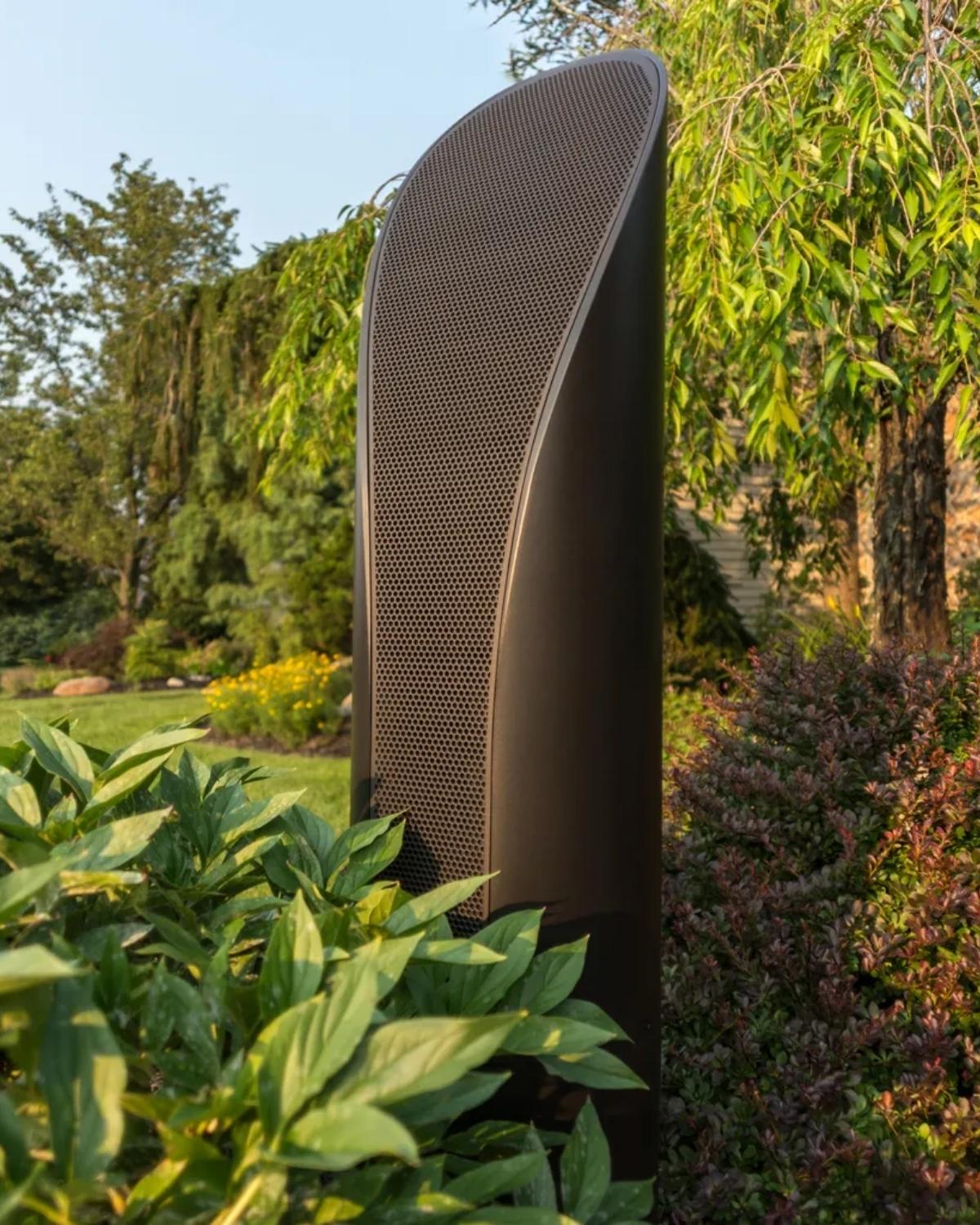 brown coastal source outdoor speaker in garden