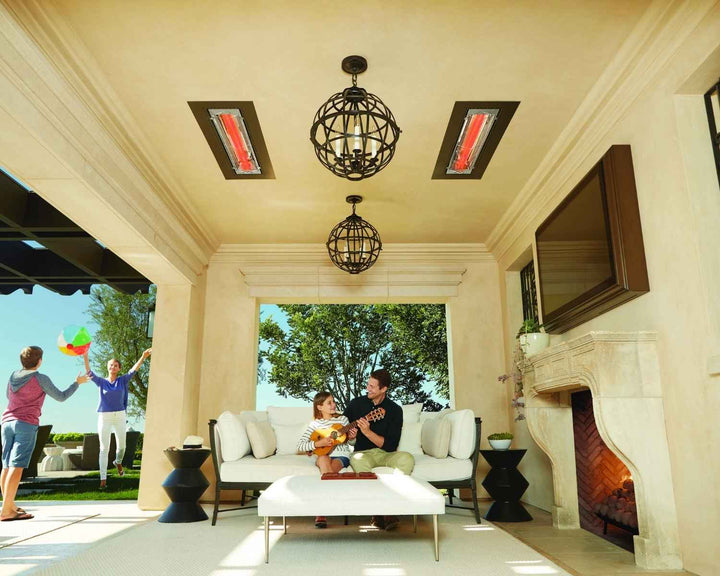 two heaters on ceiling with family sitting under it in patio