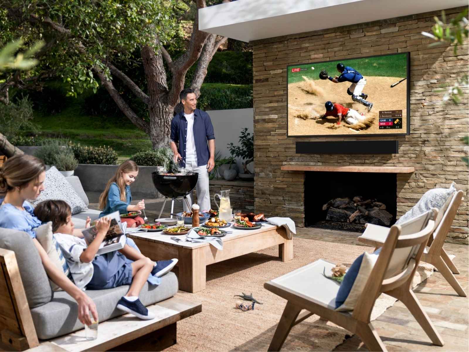 a family watching baseball in their backyard
