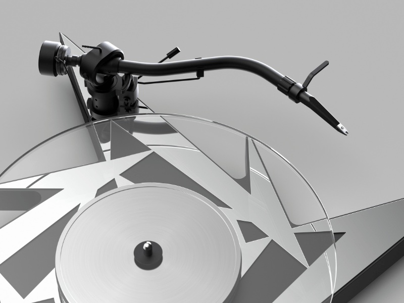 Close-up of a turntable with a stylus on a gray background