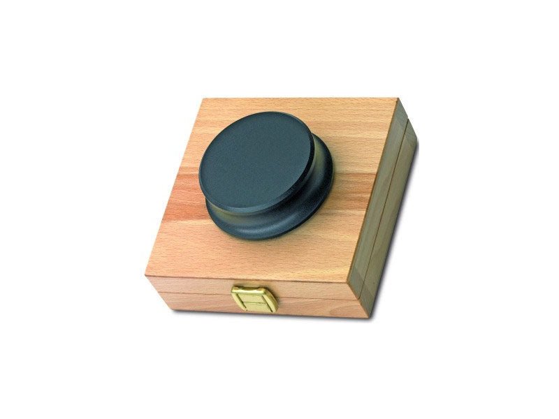 Wooden box with a dark green lid on a white background