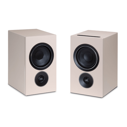 pair of psb iq2 speakers in beige