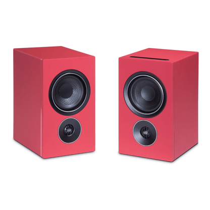 pair of psb iq2 speakers in red with grilles