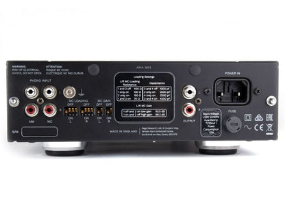 Back view of an audio component with various connectors and labels on a white background