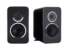 Pair of black speakers on a white background