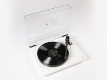 Turntable with a vinyl record on a white background