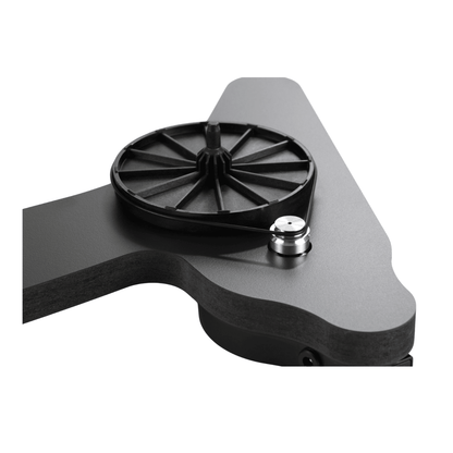 Rega Replay sub-platter detail, with the black spoked hub and drive belt looped around the polished aluminium motor pulley on a dark grey plinth.