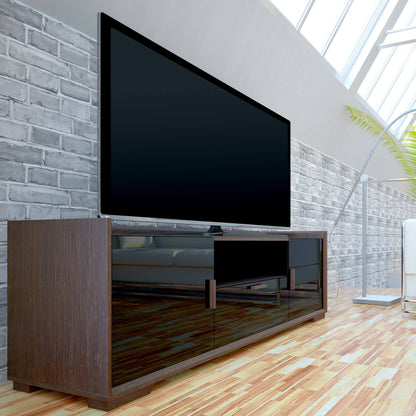 Modern TV stand with a large flat-screen TV against a brick wall.