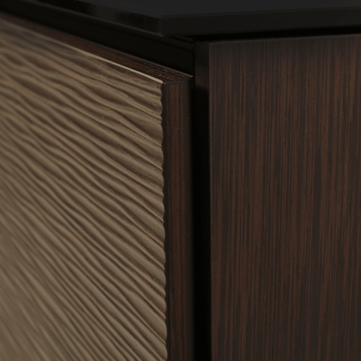 Close-up of wooden furniture with a dark finish